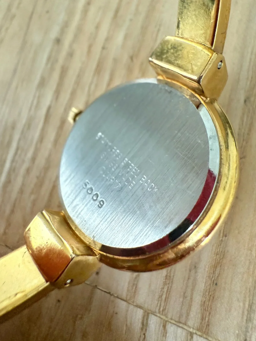 Ravisa ladies gold tone hinged bracelet Swiss made watch NEW BATTERY
